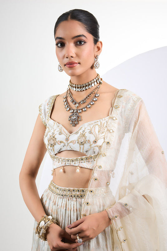 Printed chinon chiffon ivory lehenga set with pearl tassels and organza Dupatta