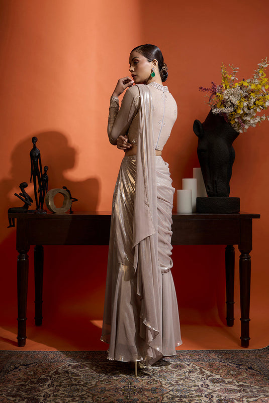 Champagne Gold Drape Saree Coupled with a Beaded Blouse