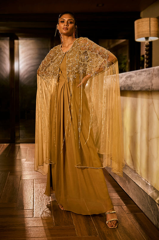 Olive green dress paired with an embellished sheer cape
