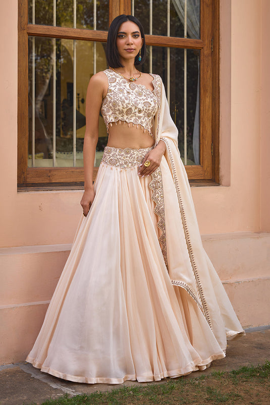 White embroidered one shoulder lehenga set