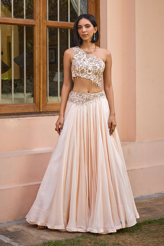 White embroidered one shoulder lehenga set