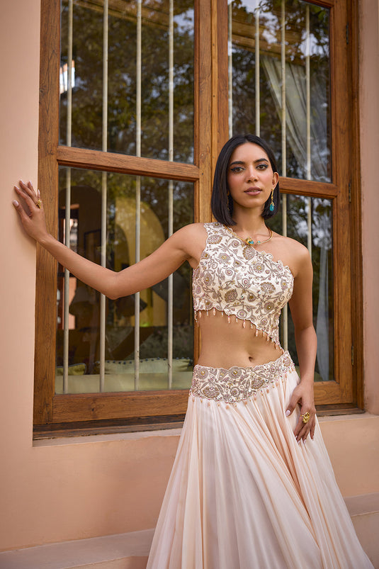 White embroidered one shoulder lehenga set