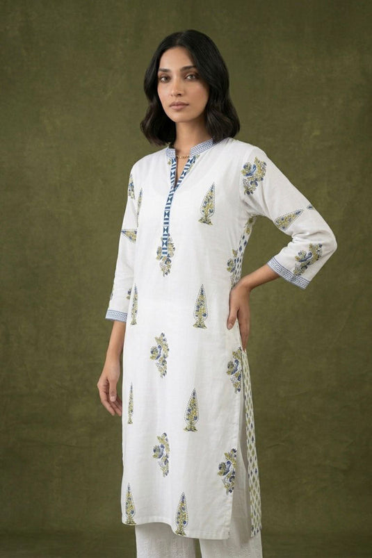 White kurta with scattered booties paired with chikankari pants