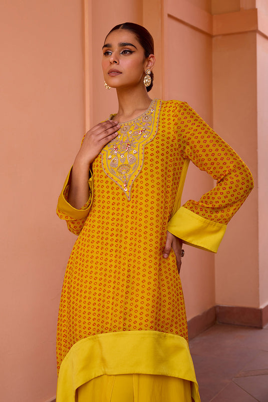 Yellow bandhani layered and embroidered kurta set with dupatta