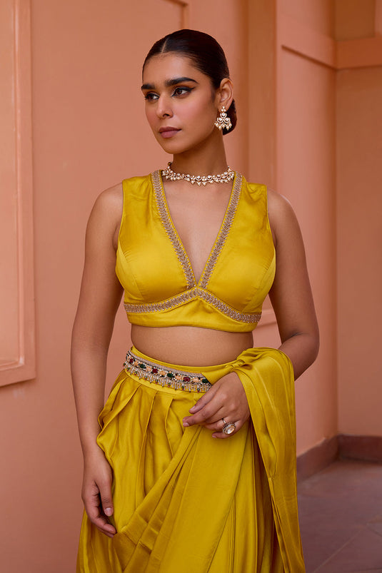 Yellow pre draped saree set with belt and embroidered blouse