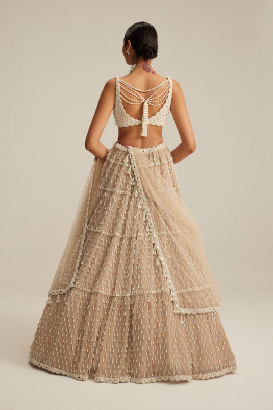 Light Beige Pearl Drop Multi Tier Lehenga Set.