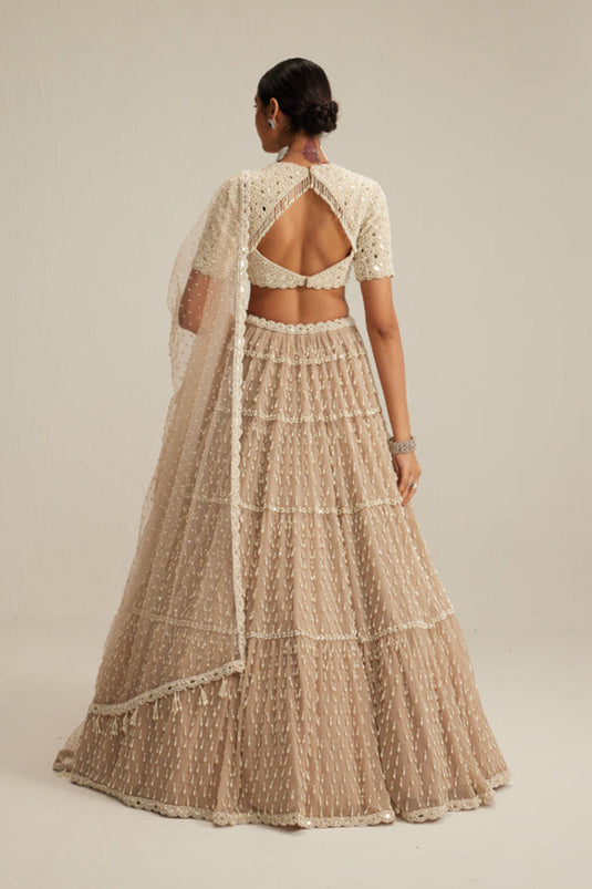 Light Beige Pearl Drop Multi Tier Lehenga With High Neck Blouse Set.