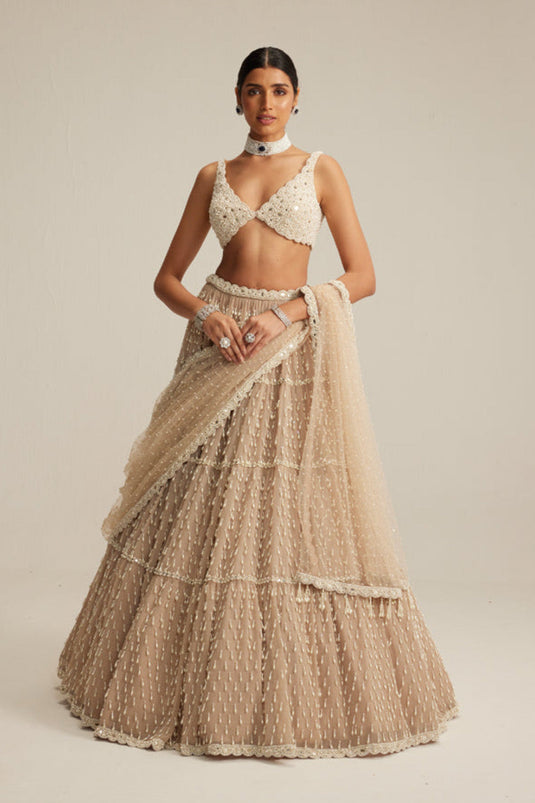 Light Beige Pearl Drop Multi Tier Lehenga Set.