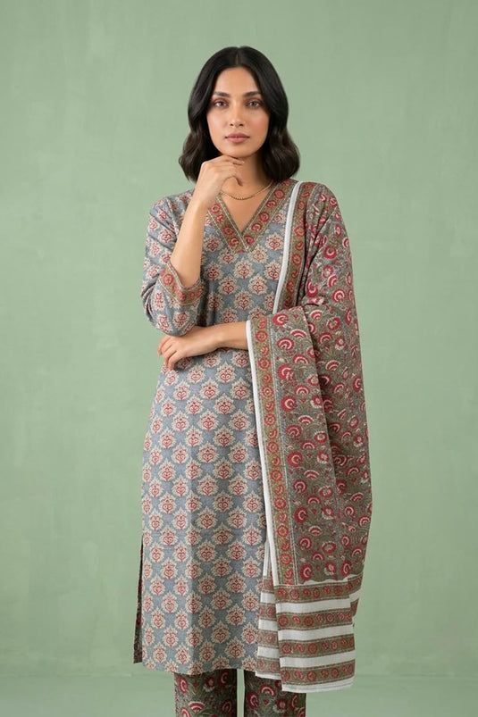 Grey suit paied with allover printed pants and dupatta