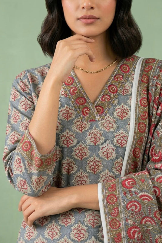 Grey suit paied with allover printed pants and dupatta