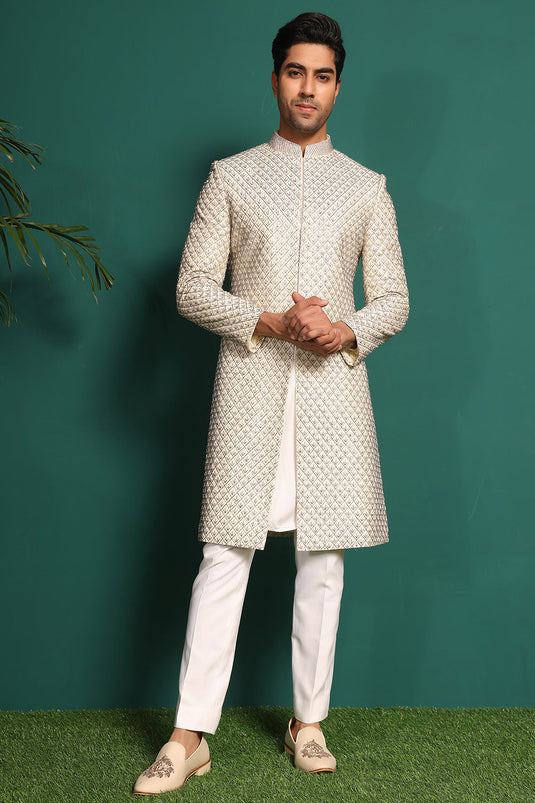 Ivory White Sherwani heavily embellished with moti and cutdaana