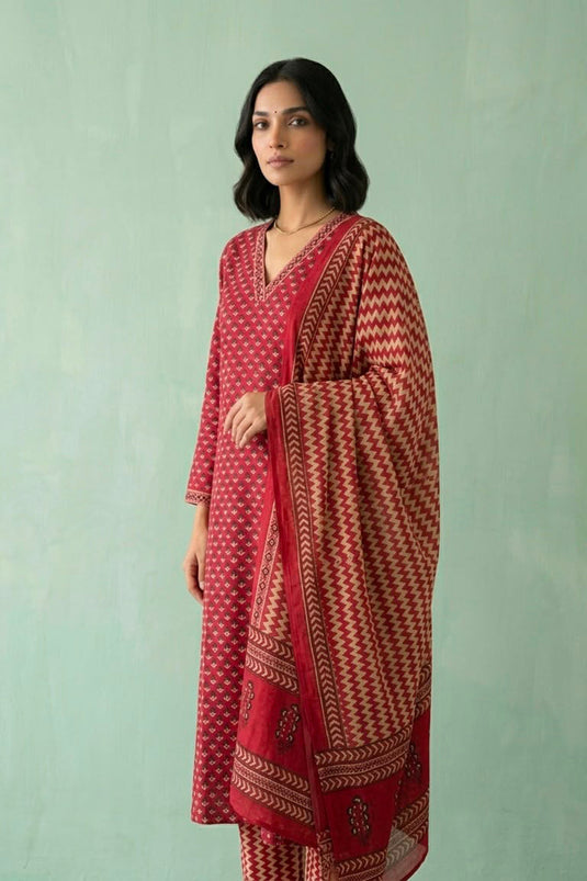 Red kurta paired with zig zag printed pants and dupatta