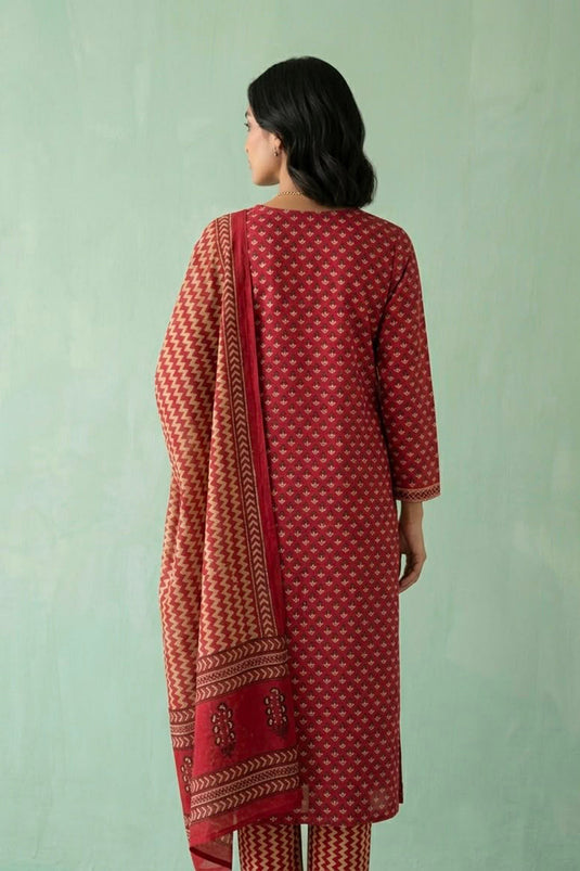 Red kurta paired with zig zag printed pants and dupatta