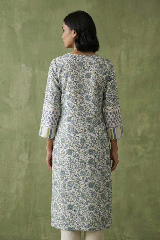 White floral kurta paired with plain pants along with block printed dupatta