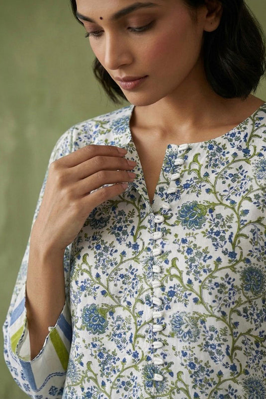 White floral kurta paired with plain pants along with block printed dupatta