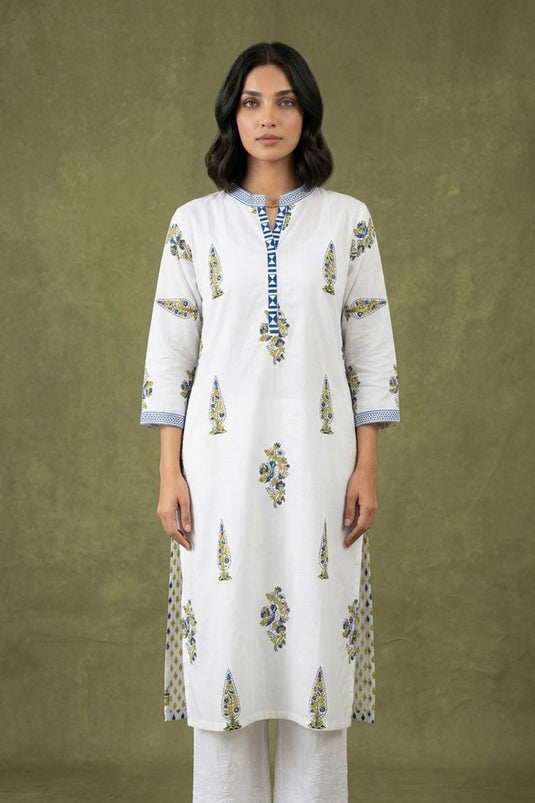 White kurta with scattered booties paired with chikankari pants