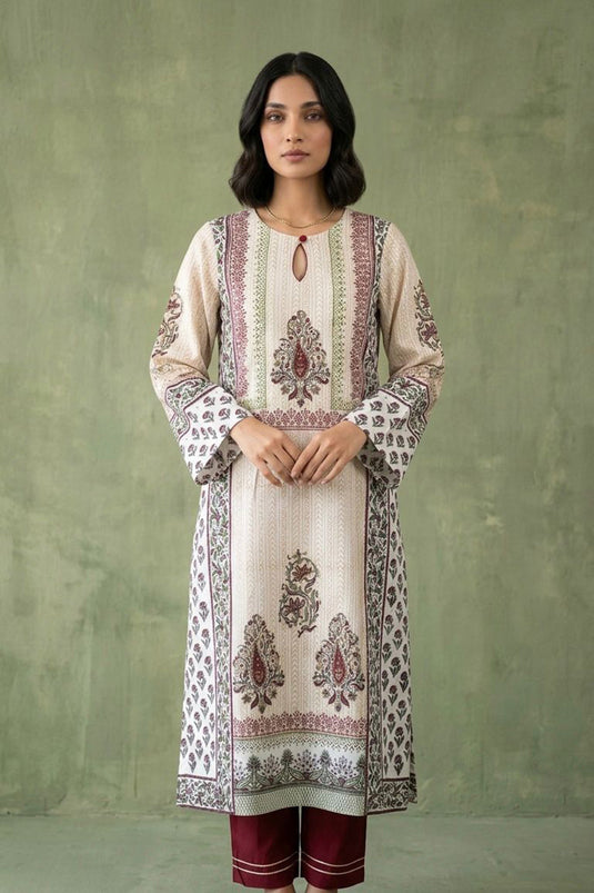 White traditional kurta paired with red pants