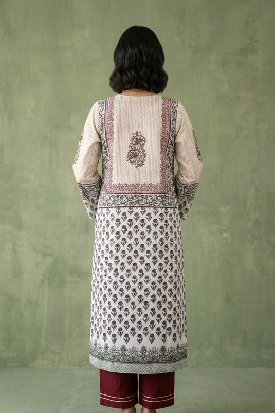 White traditional kurta paired with red pants