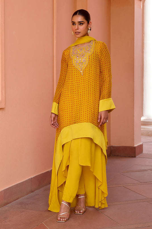 Yellow bandhani layered and embroidered kurta set with dupatta