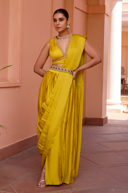 Yellow pre draped saree set with belt and embroidered blouse